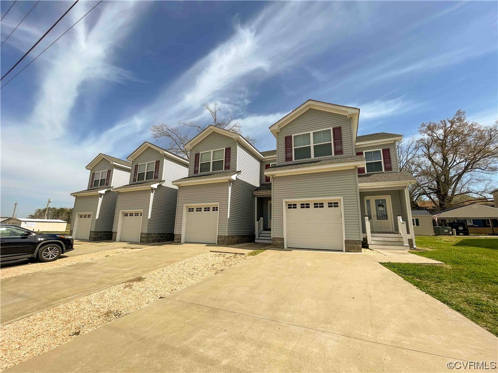 102-112 Maple Street Kenbridge, VA 23944 - Photo 3 of 11 a front view of a house with a yard