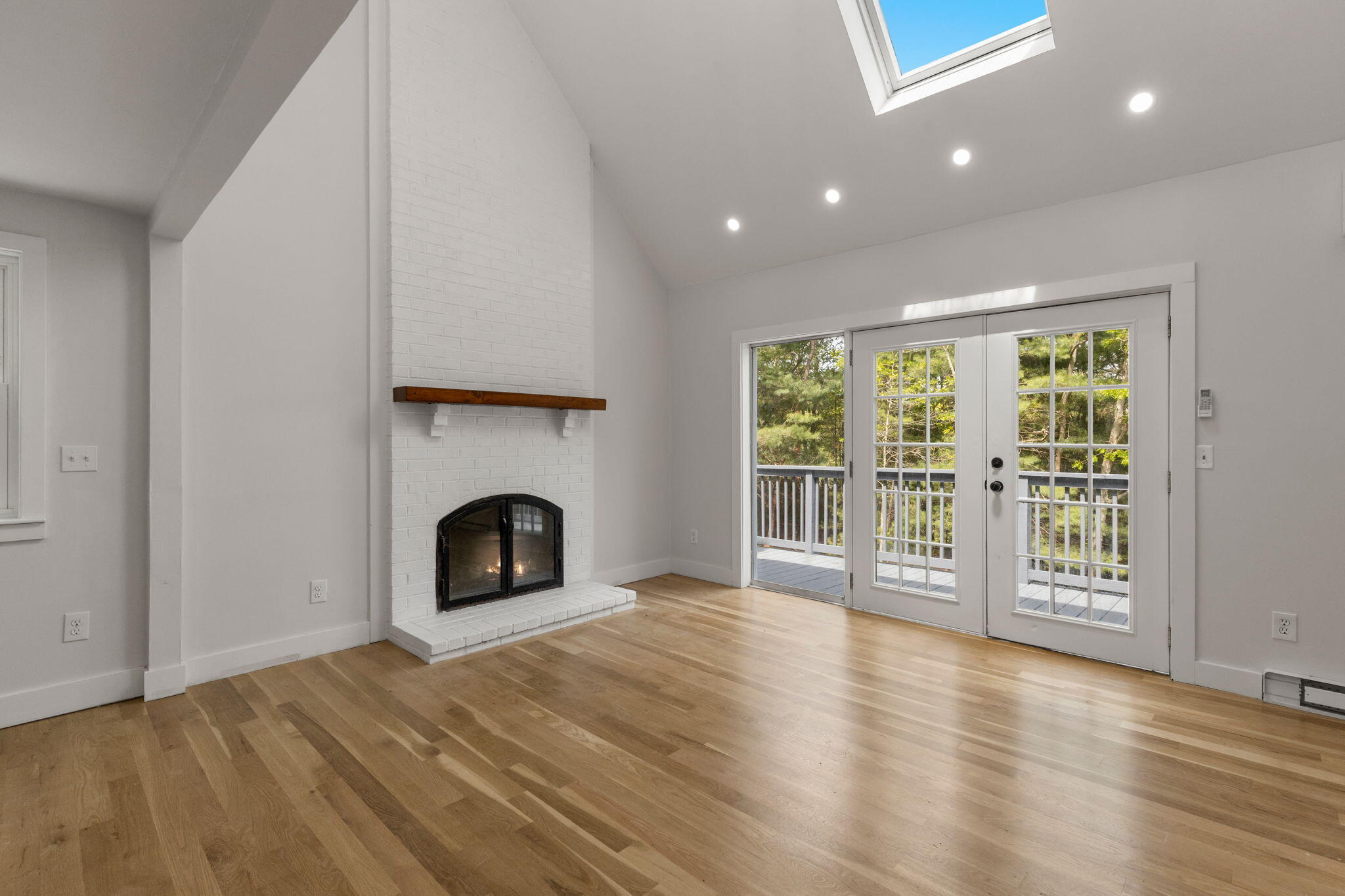 81 Sam Turner Road East Falmouth, MA 02536 - Photo 14 of 37 a view of empty room with wooden floor and fireplace