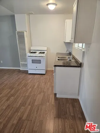 a kitchen with appliances and cabinets