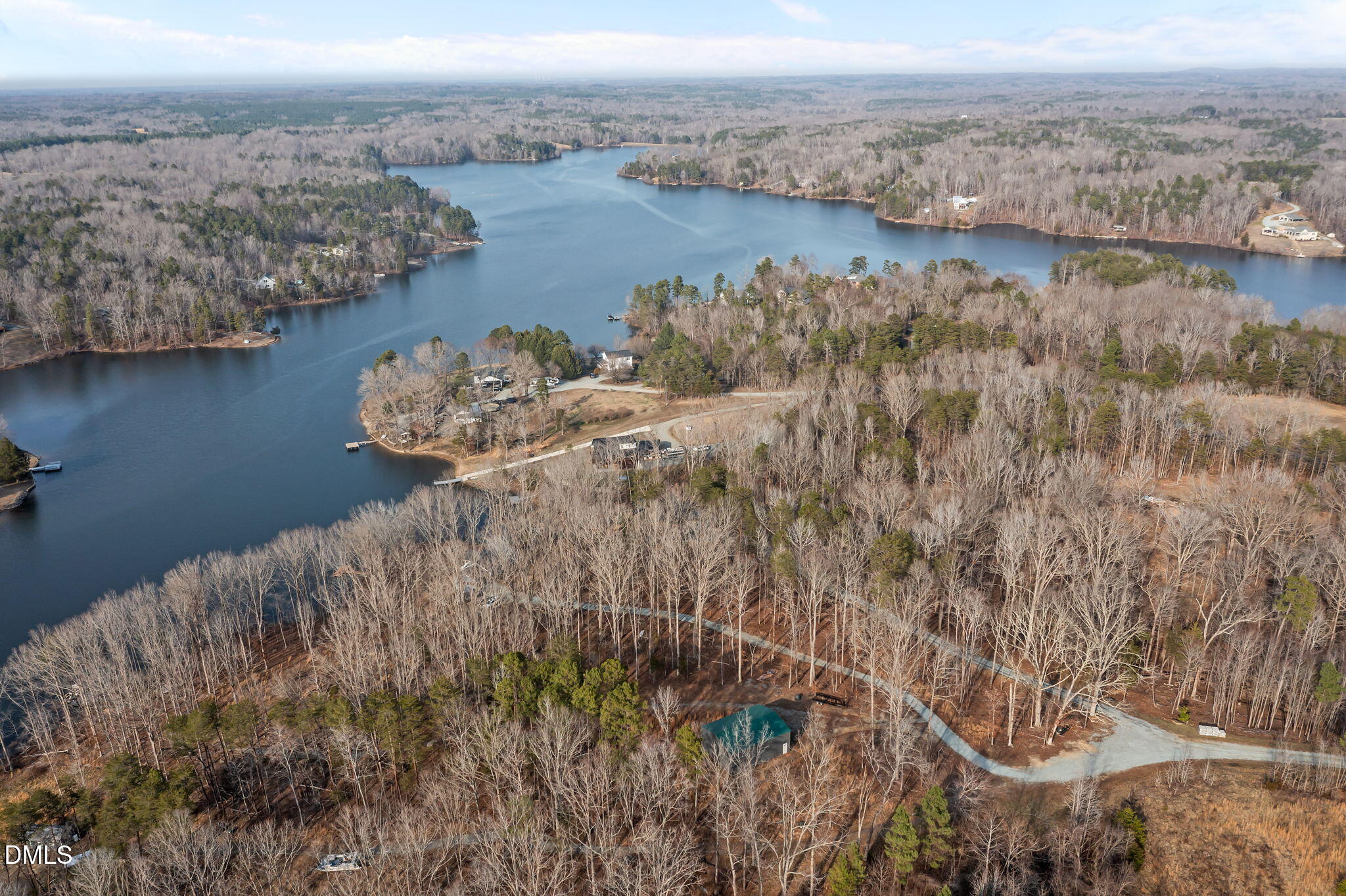 58 Lakefront Road Prospect Hill, NC 27314 - Photo 17 of 45 a view of a lake with a mountain in the back