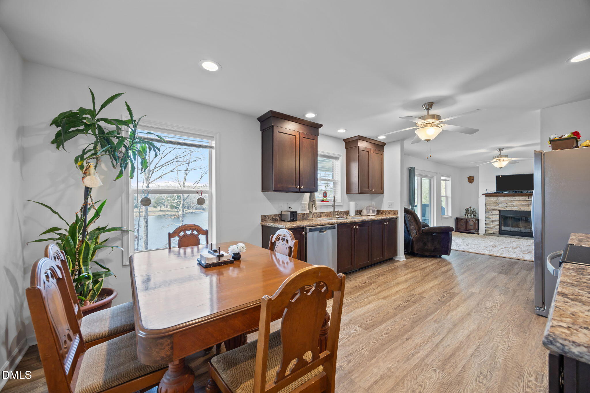 58 Lakefront Road Prospect Hill, NC 27314 - Photo 20 of 45 a view of a dining room with furniture and a potted plant