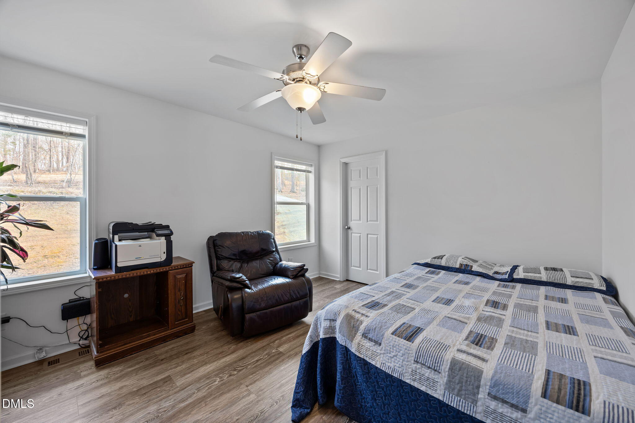 58 Lakefront Road Prospect Hill, NC 27314 - Photo 30 of 45 a bedroom with a bed and wooden floor