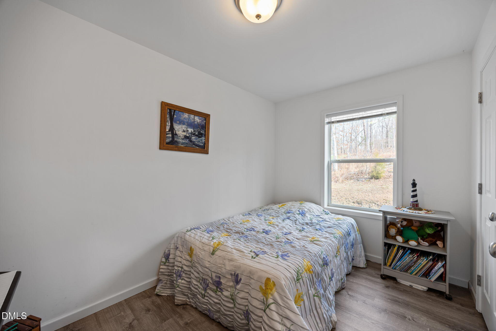 58 Lakefront Road Prospect Hill, NC 27314 - Photo 31 of 45 a bedroom with a bed and a window