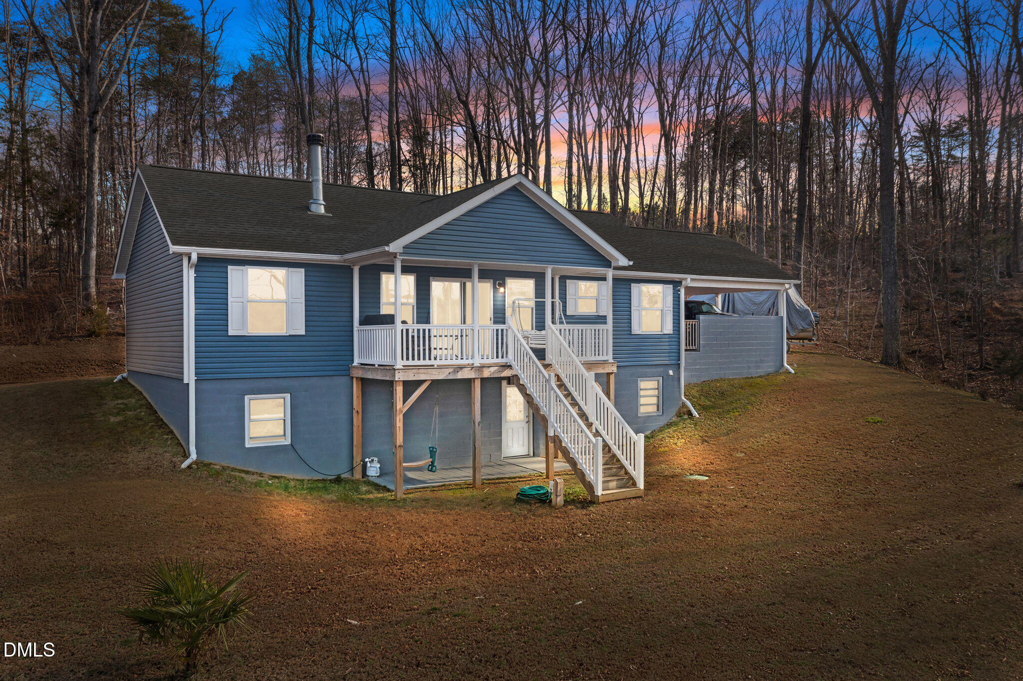 58 Lakefront Road Prospect Hill, NC 27314 - Photo 4 of 45 a front view of a house with a yard and garage