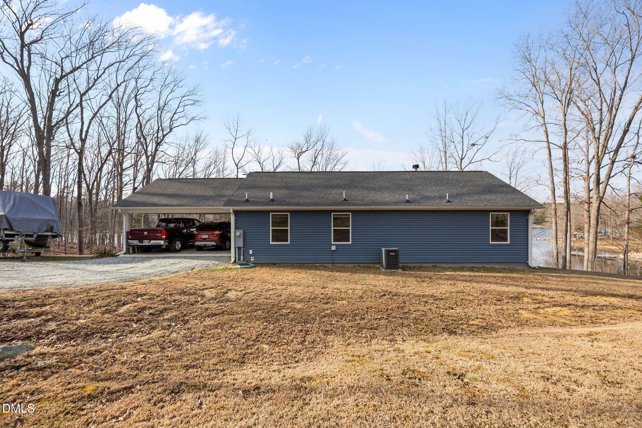 58 Lakefront Road Prospect Hill, NC 27314 - Photo 43 of 45 a house with trees in front of it