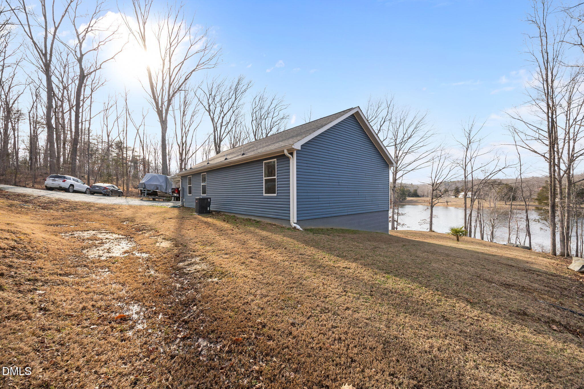 58 Lakefront Road Prospect Hill, NC 27314 - Photo 44 of 45 a view of a backyard with large trees