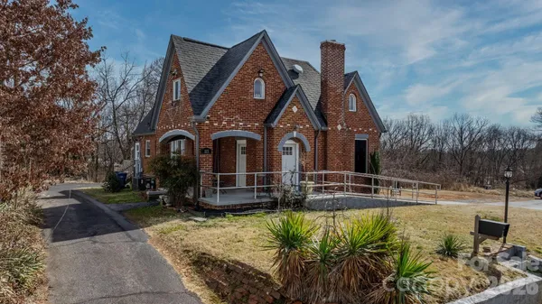 a front view of a house with swimming pool