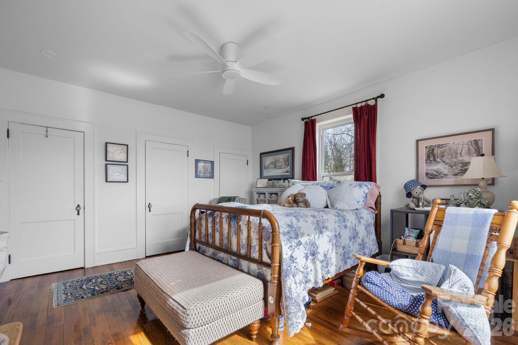 115 12th Street Southwest Hickory, NC 28602 - Photo 19 of 35 a bedroom with two beds and wooden floor