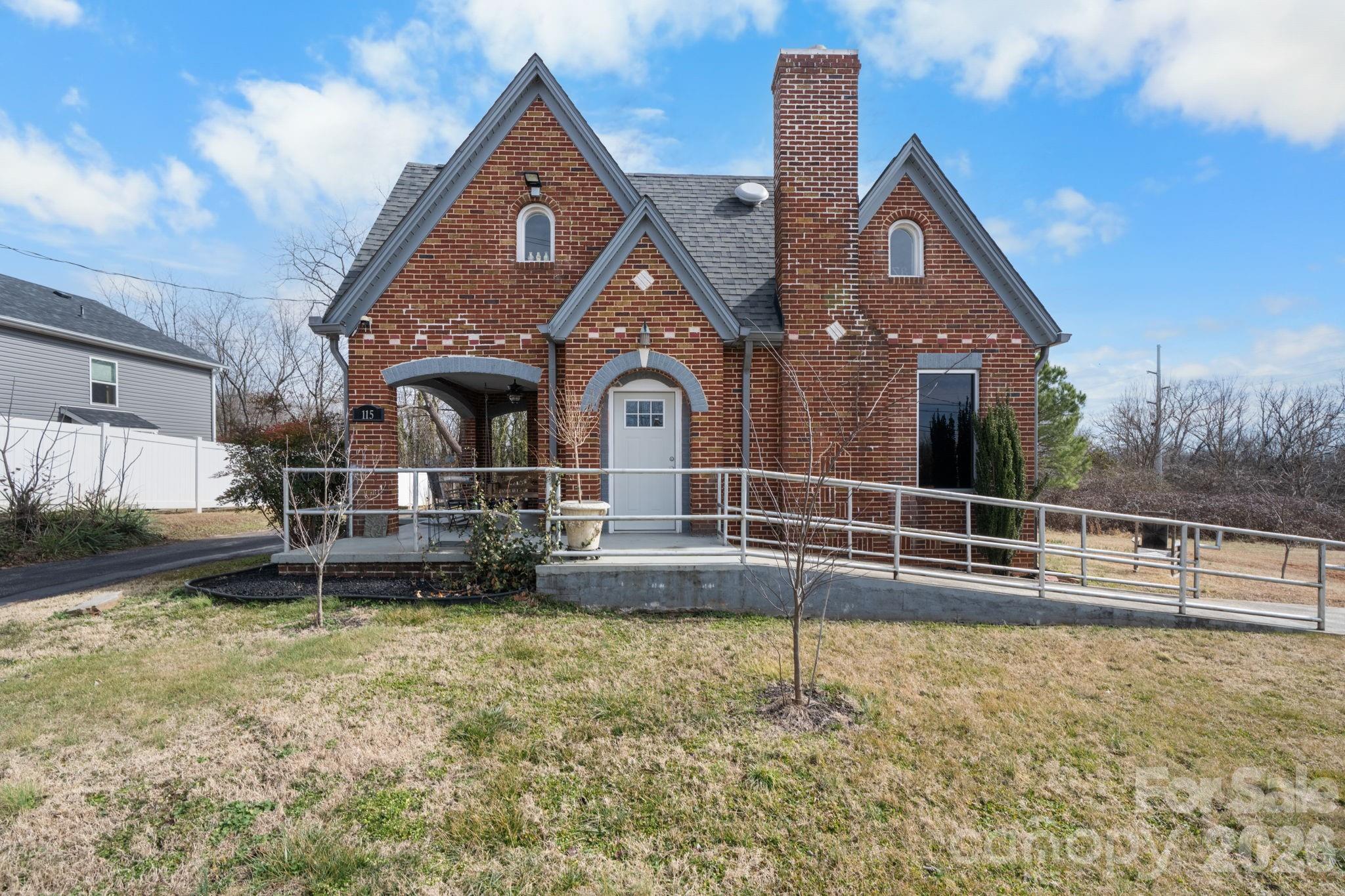 115 12th Street Southwest Hickory, NC 28602 - Photo 2 of 35 a front view of a house with a yard