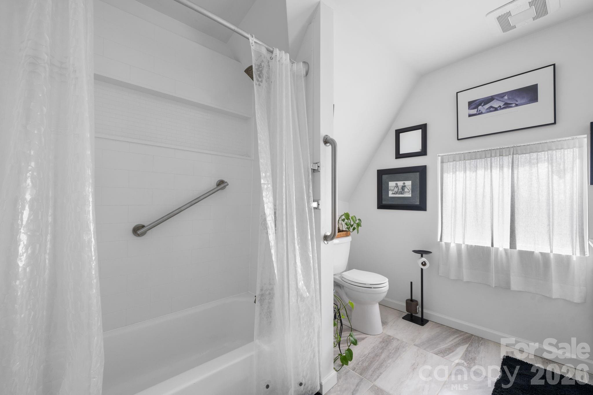 115 12th Street Southwest Hickory, NC 28602 - Photo 29 of 35 a bathroom with a toilet and a shower