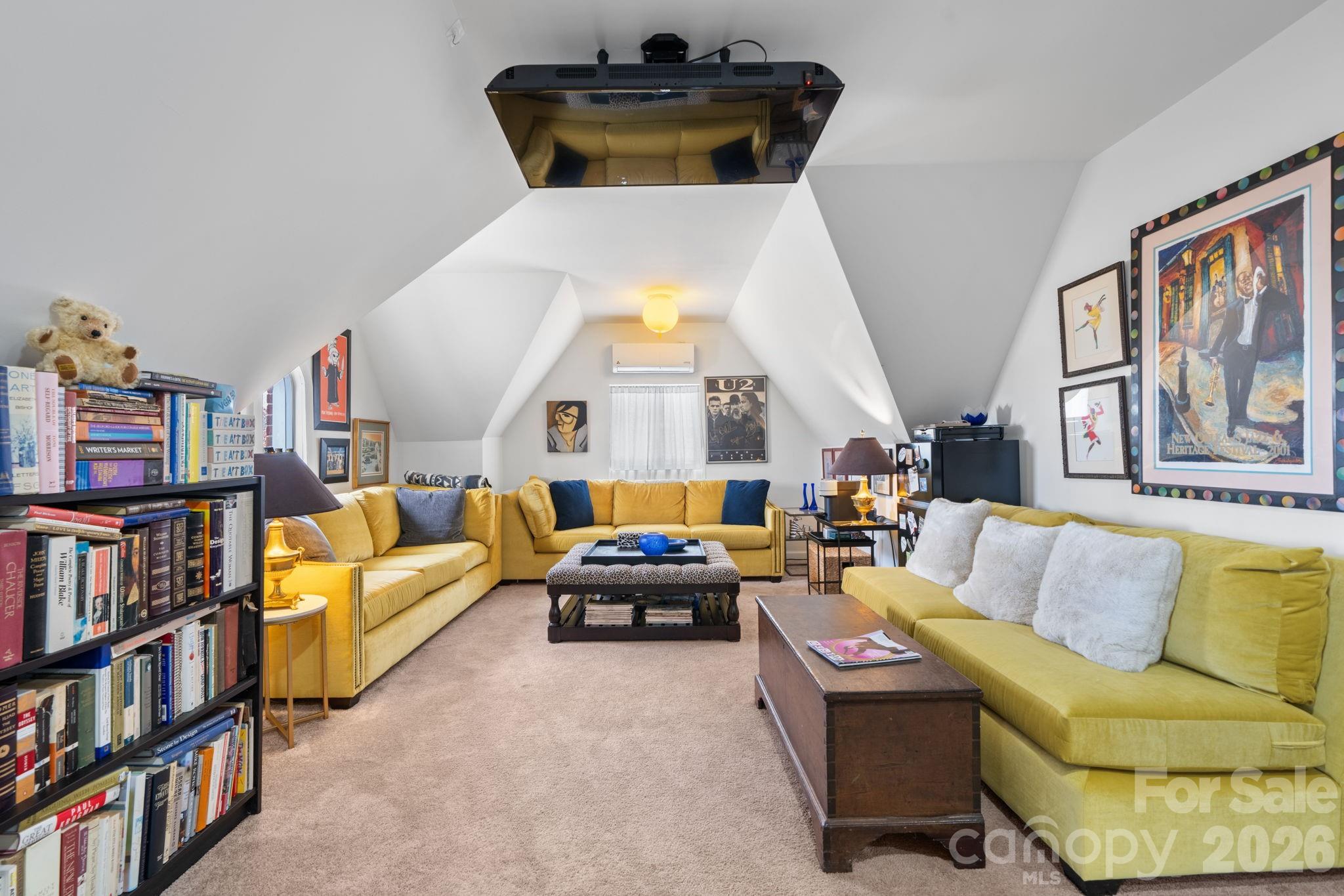 115 12th Street Southwest Hickory, NC 28602 - Photo 33 of 35 a living room with furniture and a book shelf