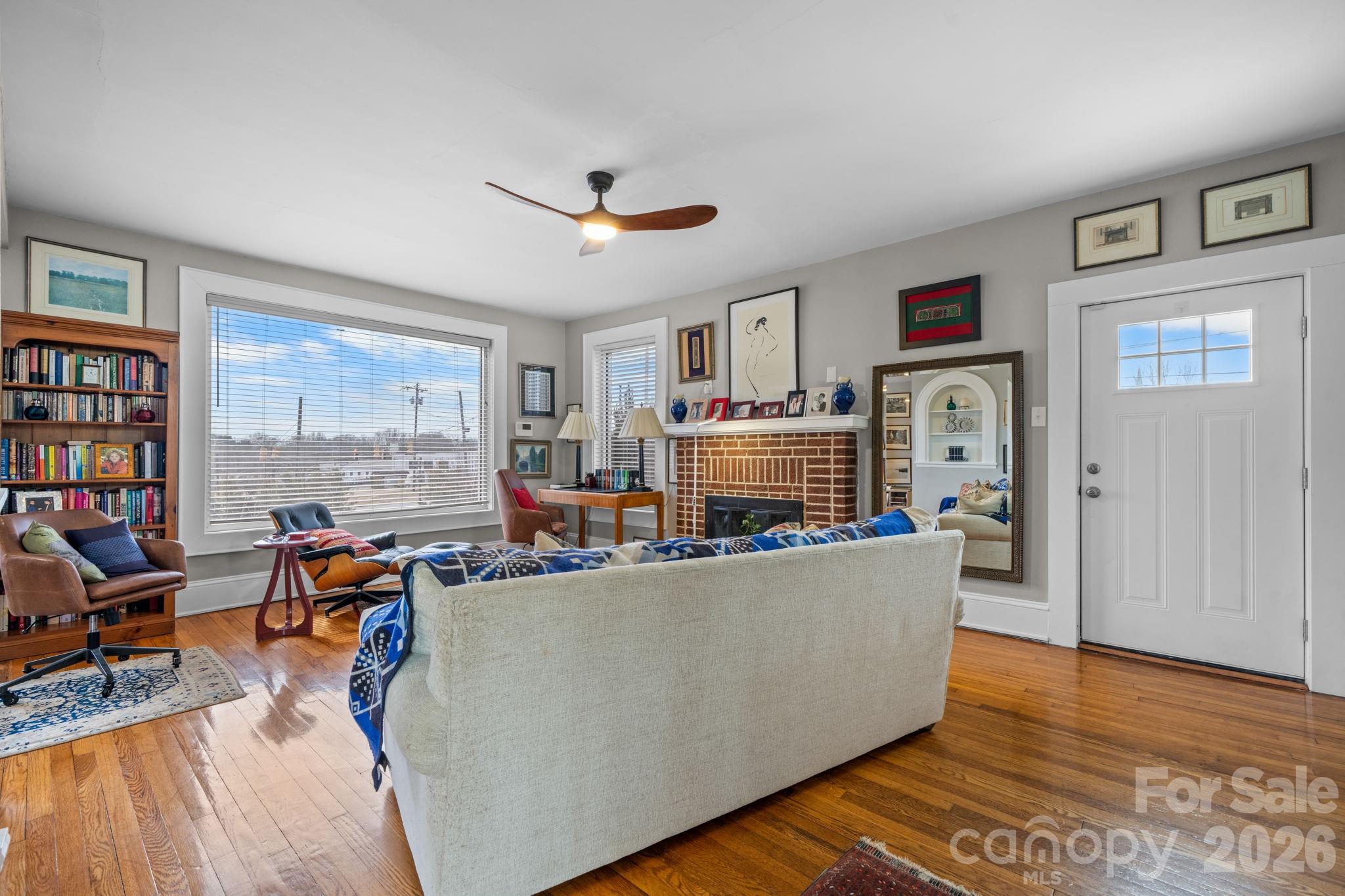 115 12th Street Southwest Hickory, NC 28602 - Photo 4 of 35 a living room with furniture and a flat screen tv