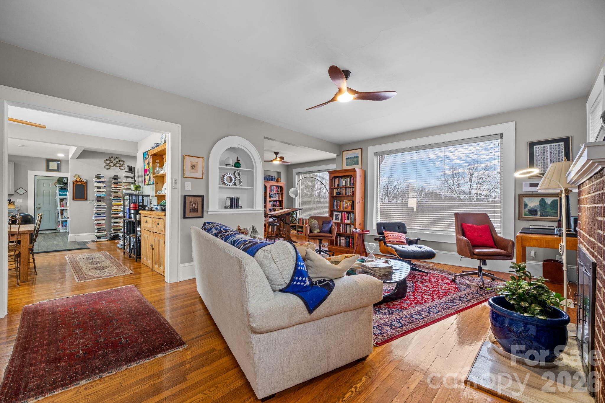 115 12th Street Southwest Hickory, NC 28602 - Photo 6 of 35 a living room with furniture fireplace and a large window