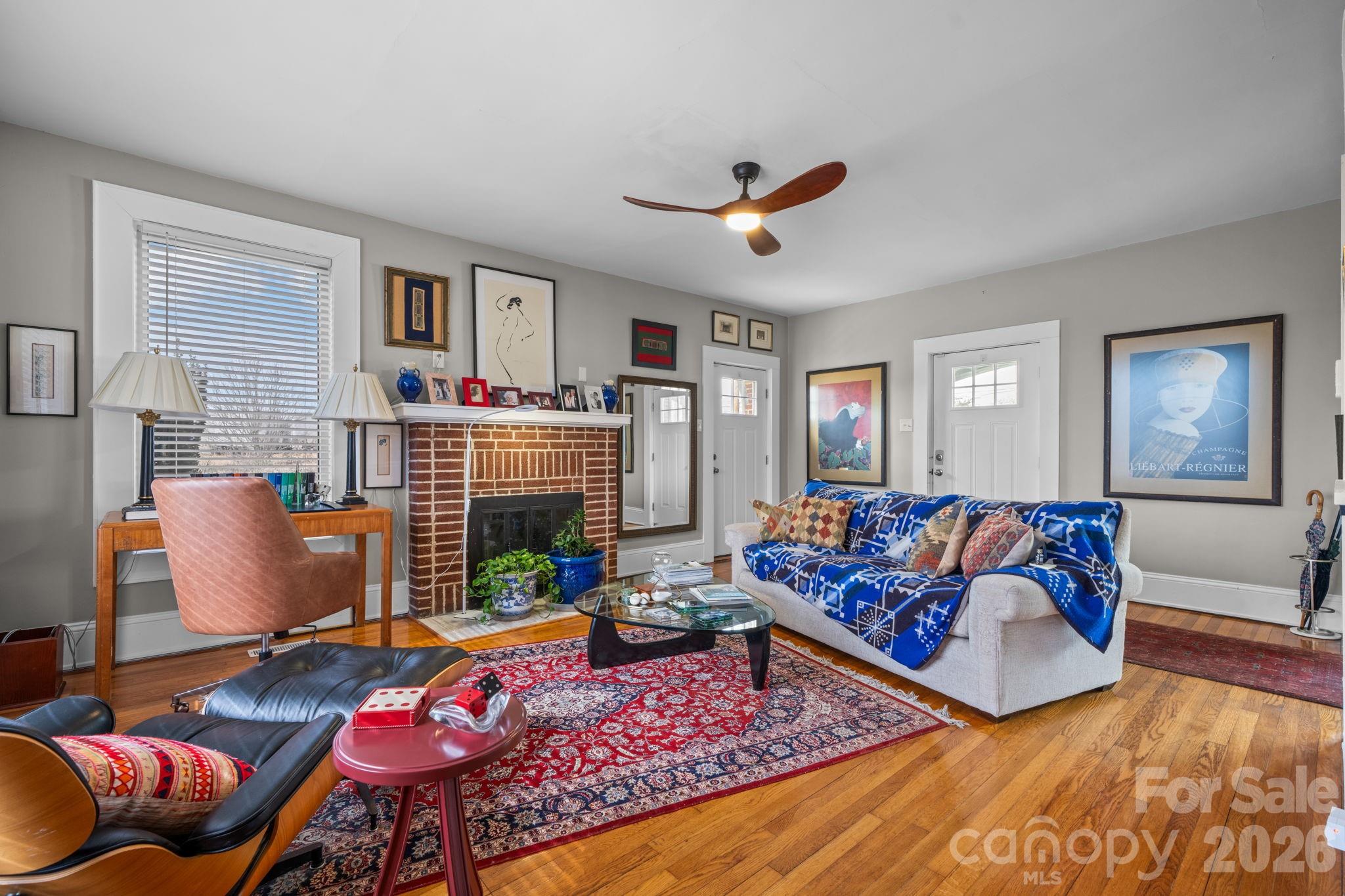 115 12th Street Southwest Hickory, NC 28602 - Photo 7 of 35 a living room with furniture and a couch