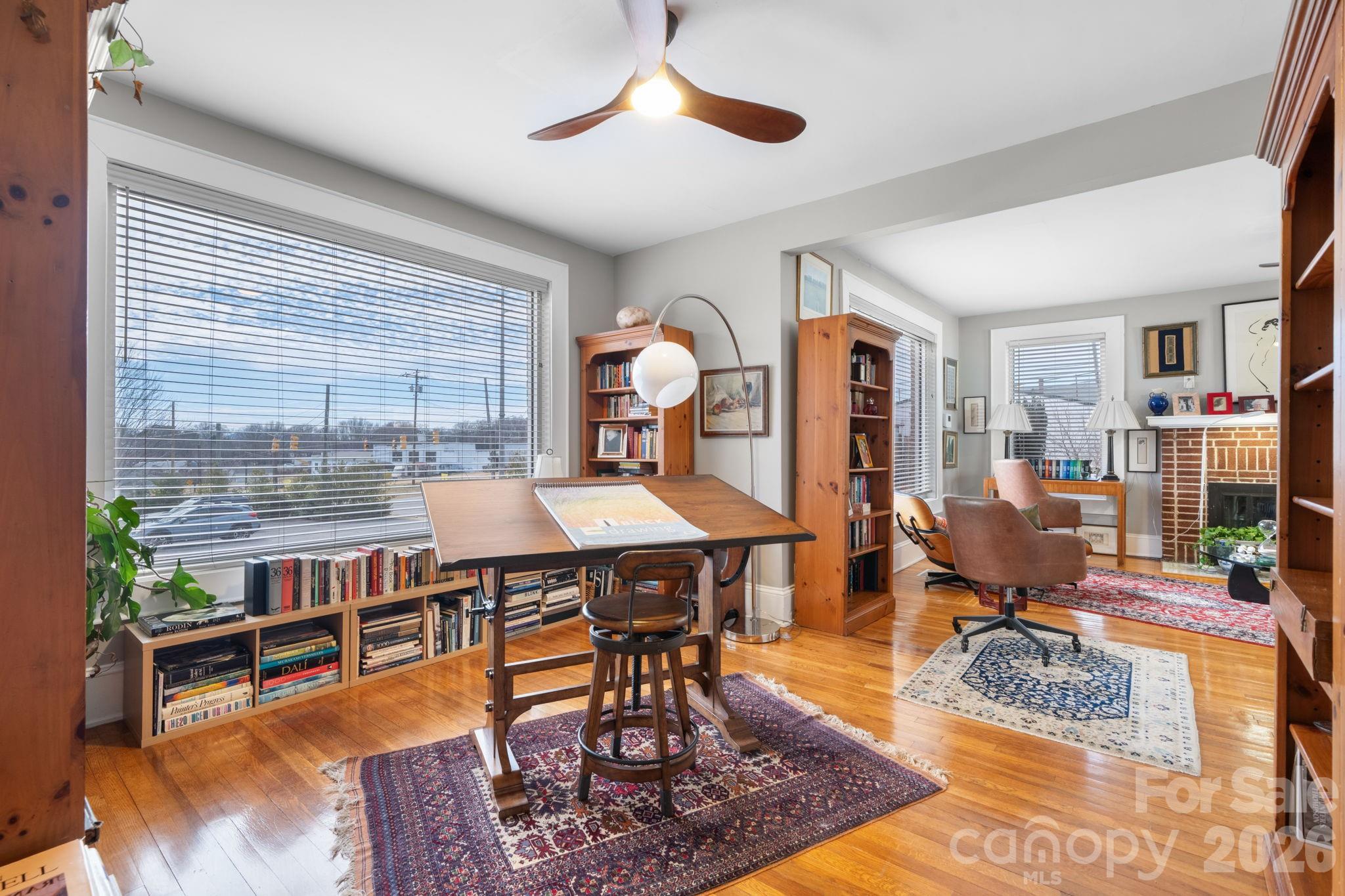 115 12th Street Southwest Hickory, NC 28602 - Photo 9 of 35 a living room with furniture a rug and a chandelier
