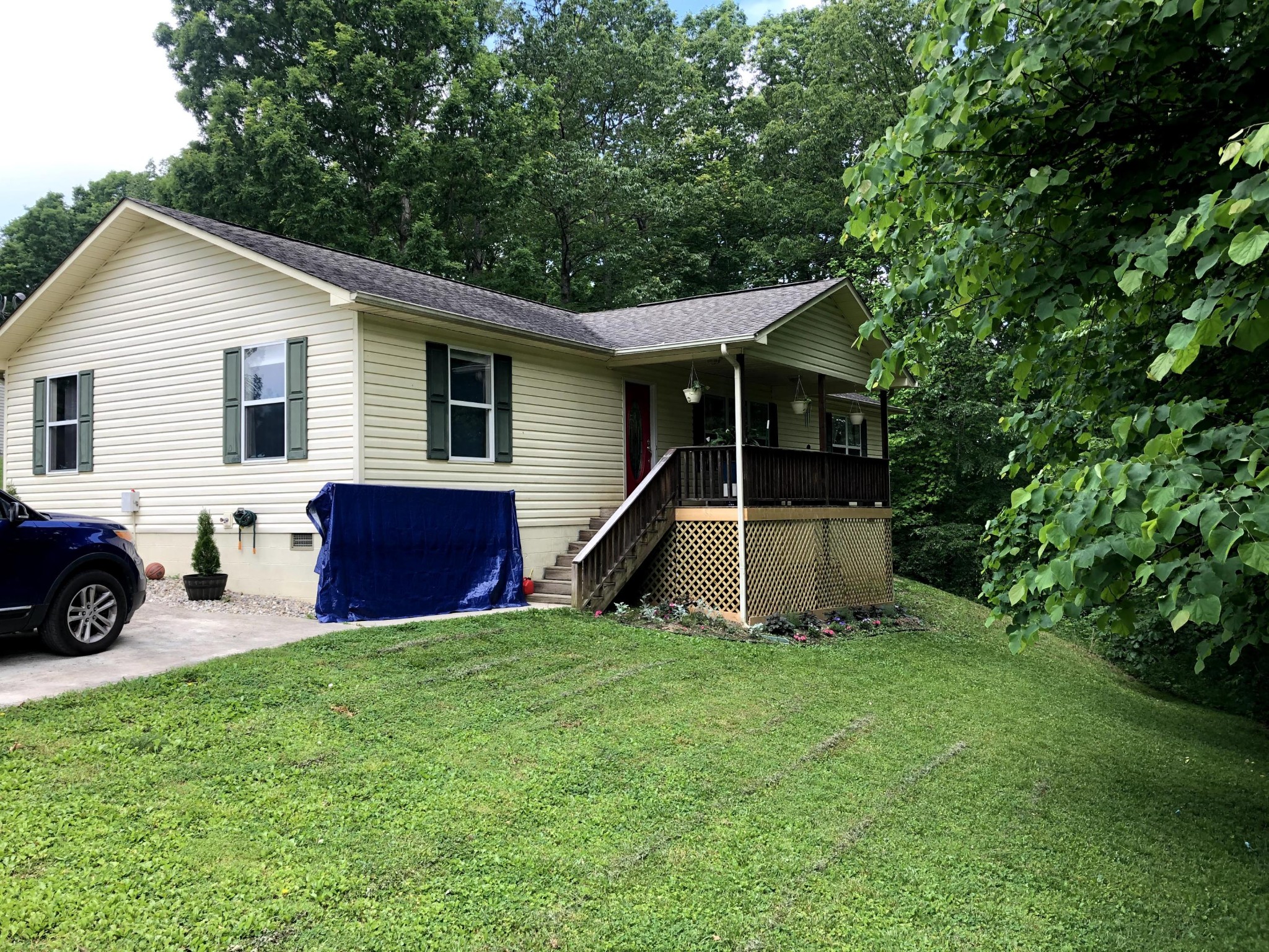 915 Sand Cut Road Oneida, TN 37841 - Photo 3 of 19 a view of a house with a yard and sitting area