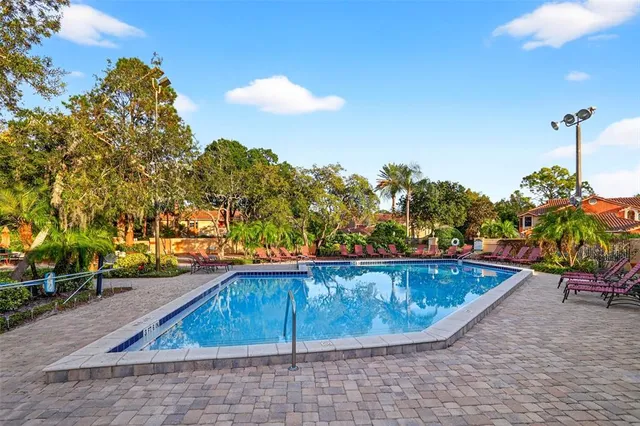 a view of a swimming pool with a patio