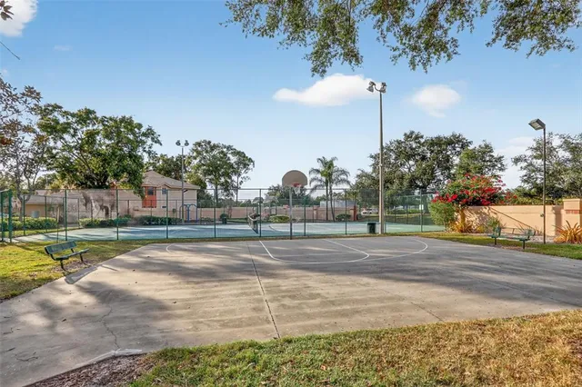 a view of a fountain in a yard with a house