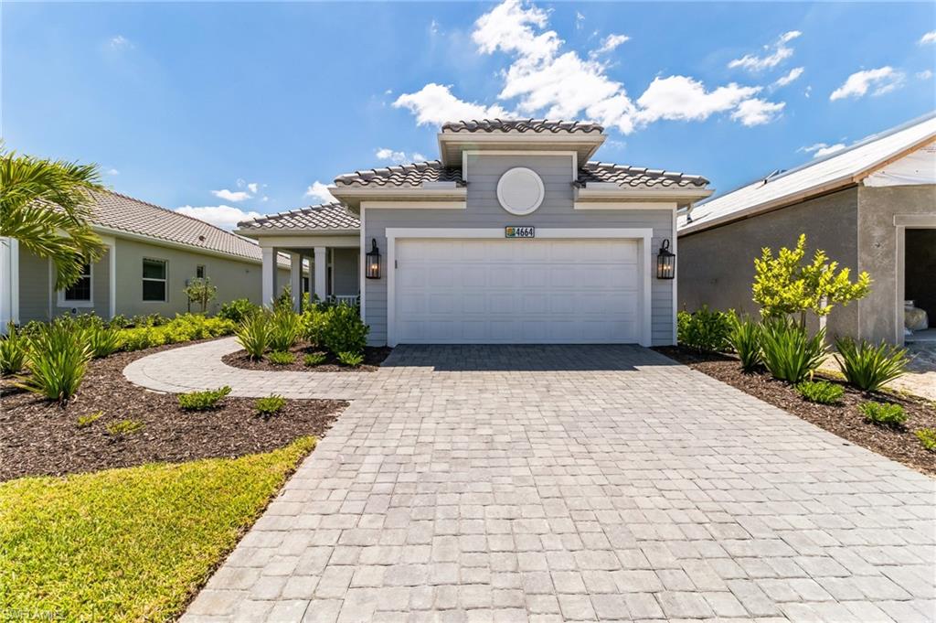 4664 Centaurus Circle Naples, FL 34120 - Photo 2 of 37 a front view of house with yard
