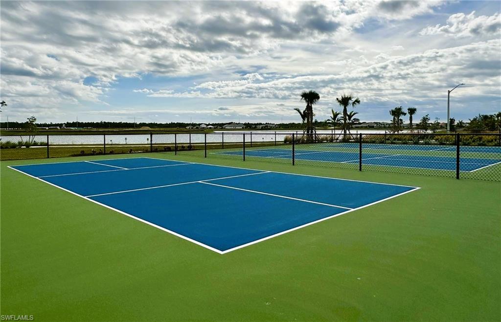 4664 Centaurus Circle Naples, FL 34120 - Photo 35 of 37 a view of an outdoor space and tennis court