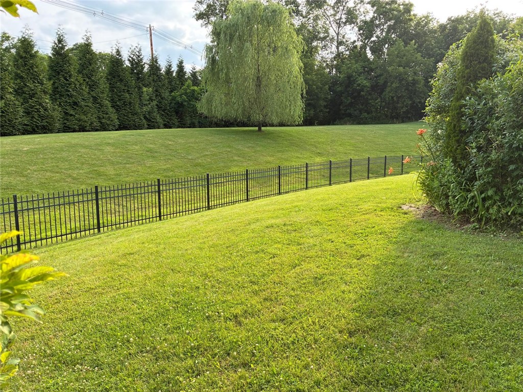 18 Dona Lea Road Perinton, NY 14450 - Photo 23 of 29 A park-like, fully-fenced rear yard awaits your enjoyment.