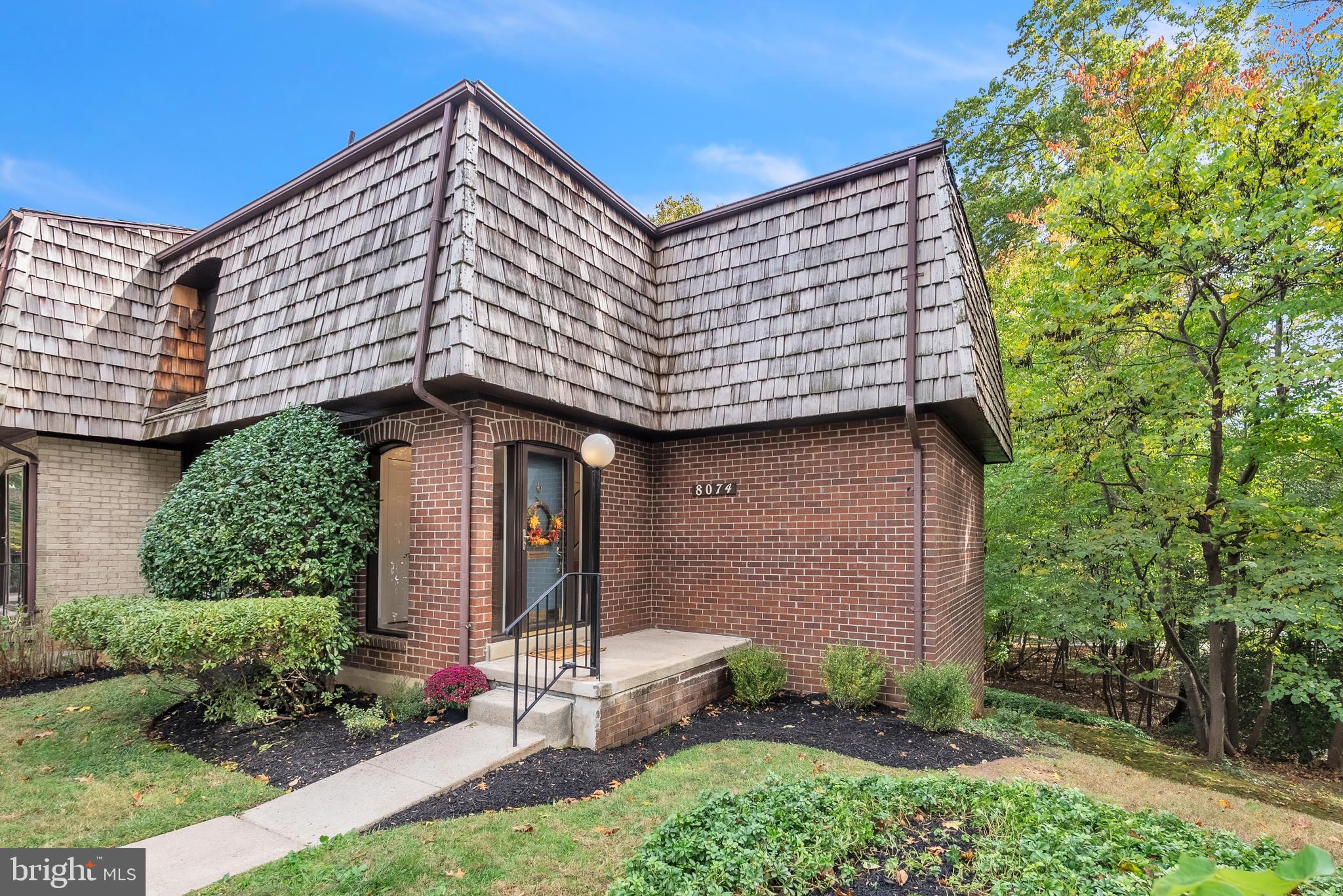 8074 Inverness Ridge Road Potomac, MD 20854 - Photo 1 of 41 a front view of a house with garden