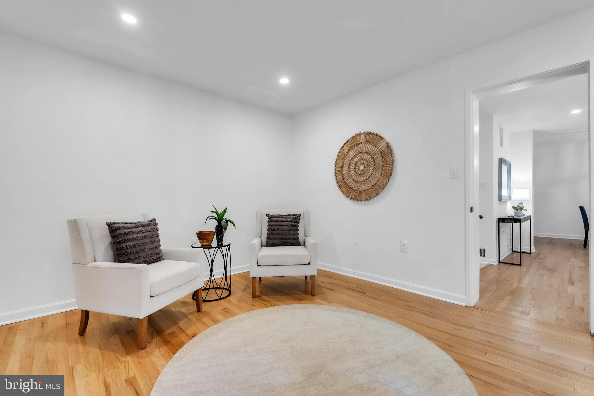 8074 Inverness Ridge Road Potomac, MD 20854 - Photo 13 of 41 a living room with furniture and a wooden floor