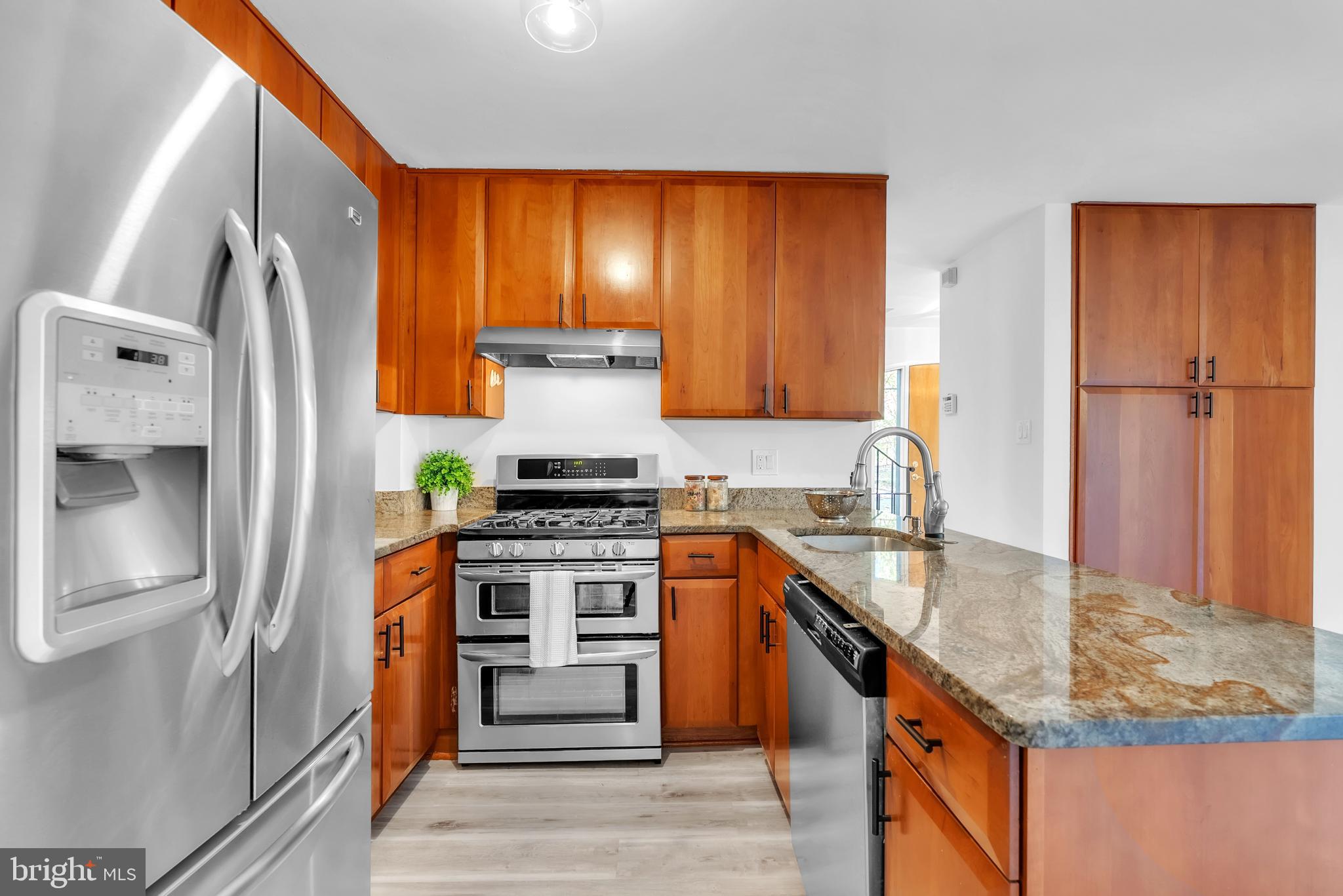 8074 Inverness Ridge Road Potomac, MD 20854 - Photo 15 of 41 a kitchen with stainless steel appliances granite countertop a stove a sink and a refrigerator