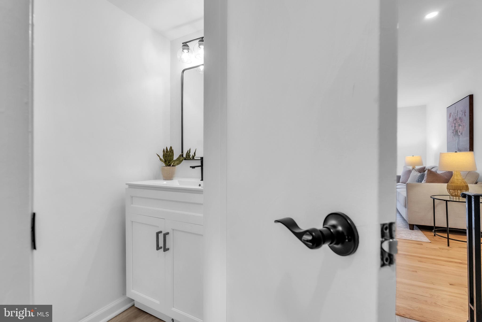 8074 Inverness Ridge Road Potomac, MD 20854 - Photo 17 of 41 a bathroom with a sink and a mirror