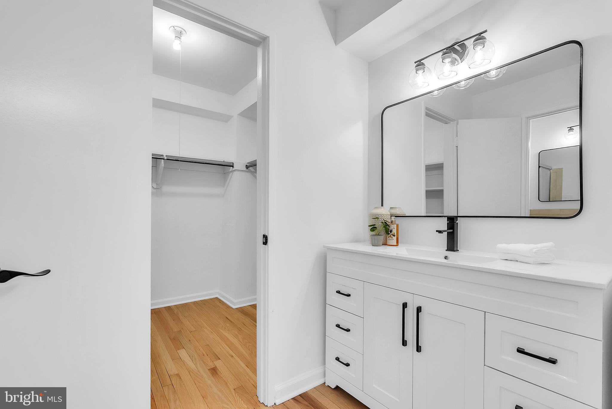 8074 Inverness Ridge Road Potomac, MD 20854 - Photo 19 of 41 a bathroom with a sink and a mirror