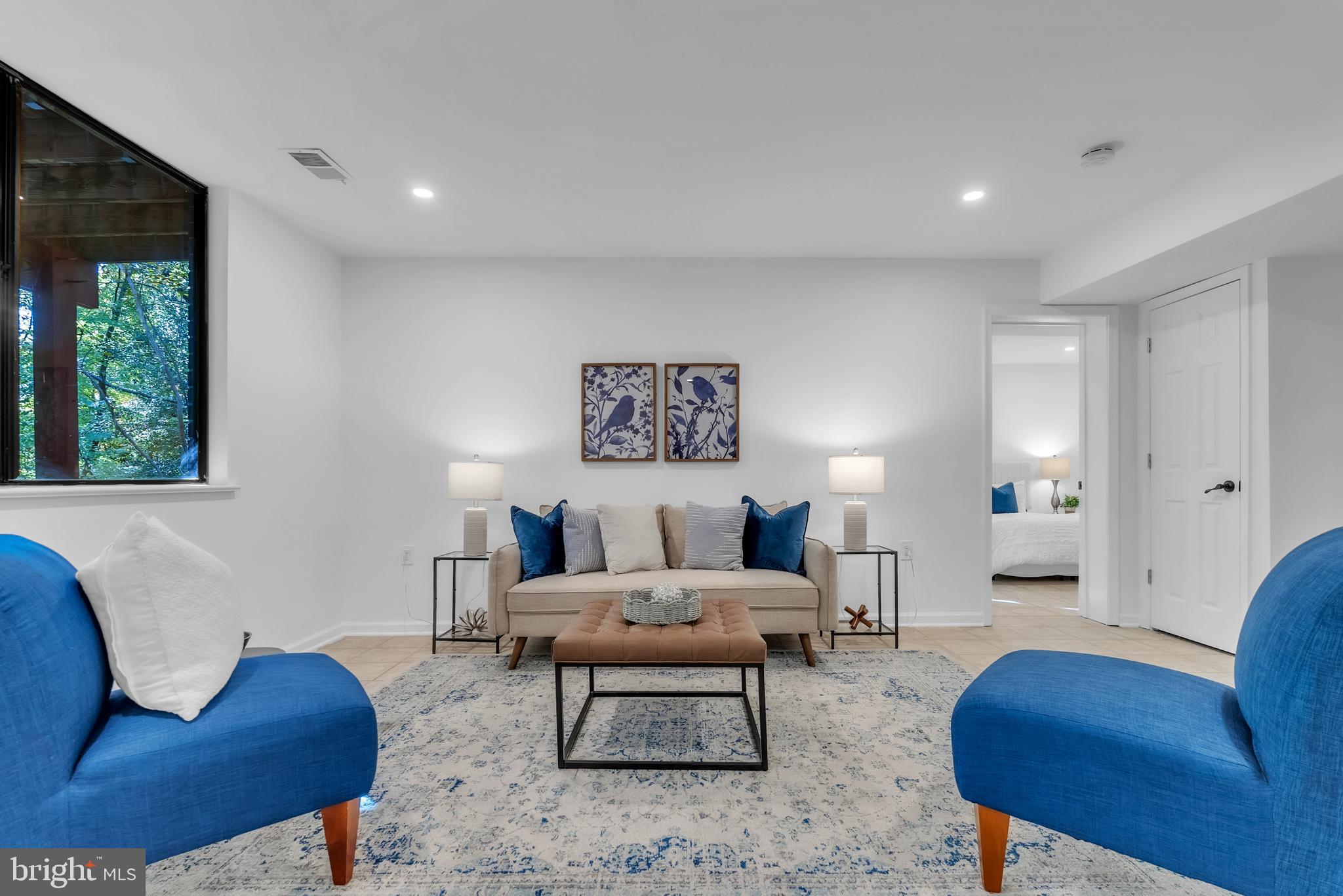 8074 Inverness Ridge Road Potomac, MD 20854 - Photo 28 of 41 a living room with furniture a rug and a lamp