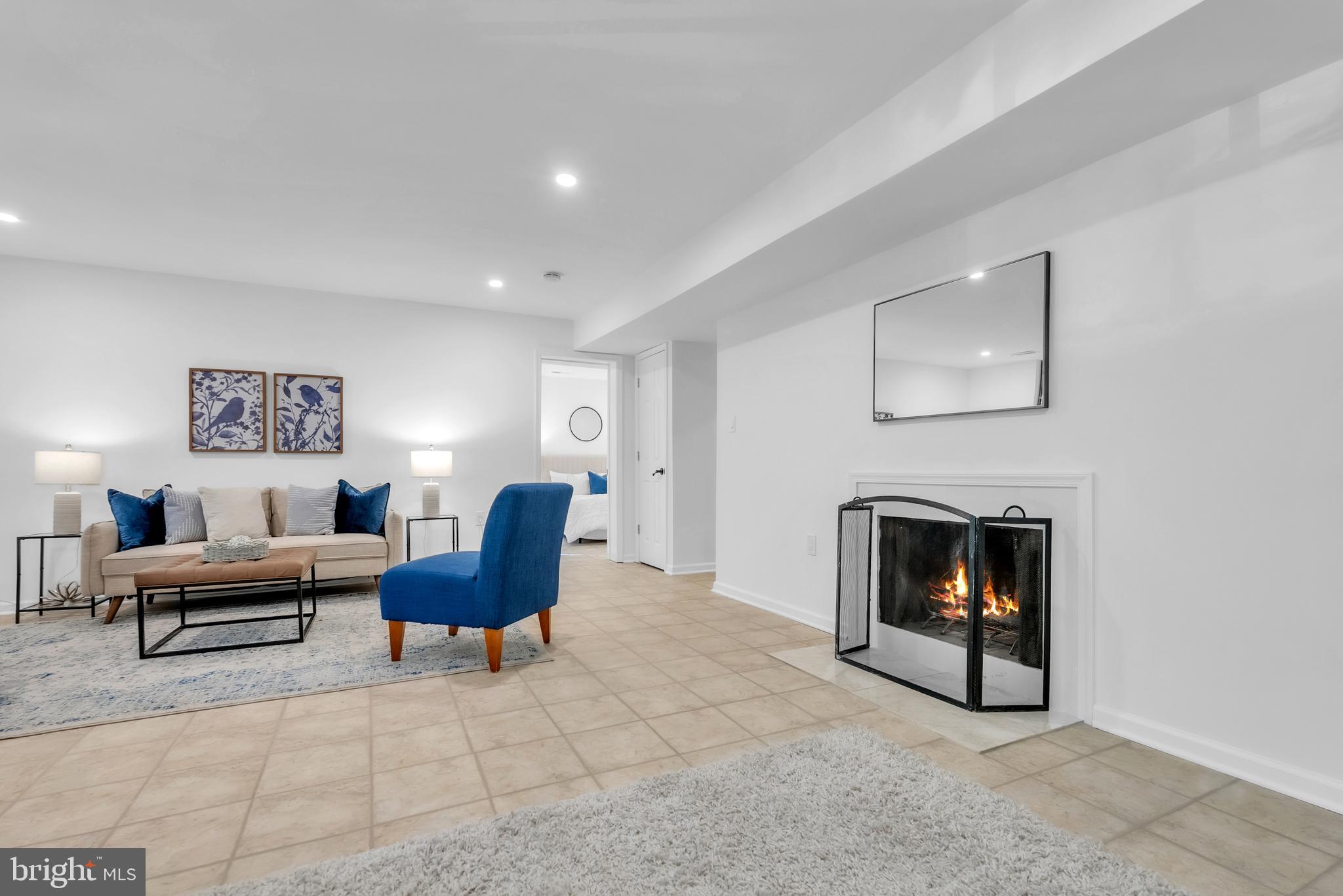8074 Inverness Ridge Road Potomac, MD 20854 - Photo 29 of 41 a living room with furniture and a fireplace