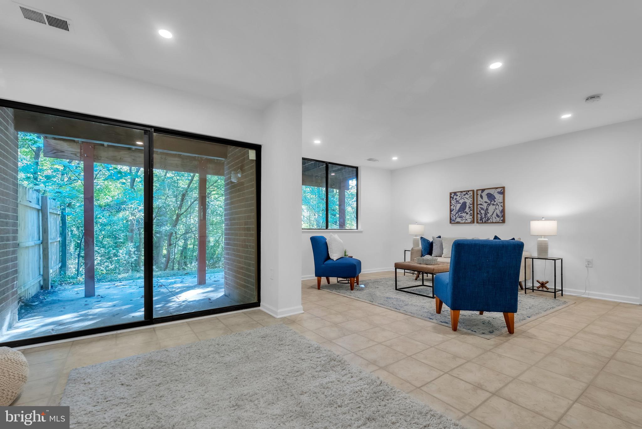 8074 Inverness Ridge Road Potomac, MD 20854 - Photo 30 of 41 a living room with furniture and a window