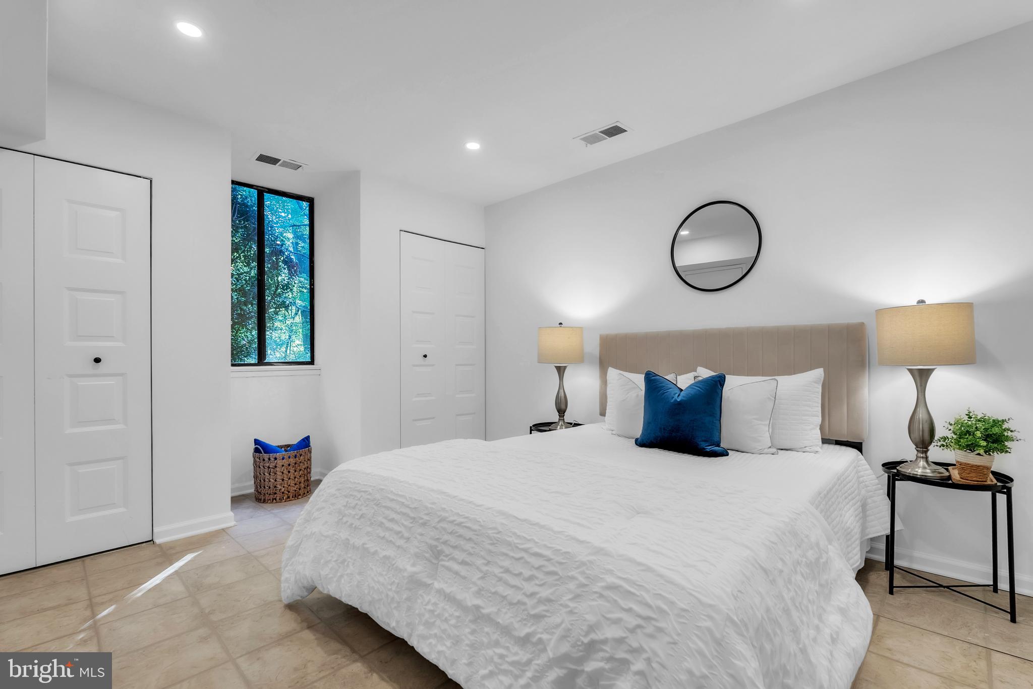 8074 Inverness Ridge Road Potomac, MD 20854 - Photo 32 of 41 a bedroom with a bed and lamps