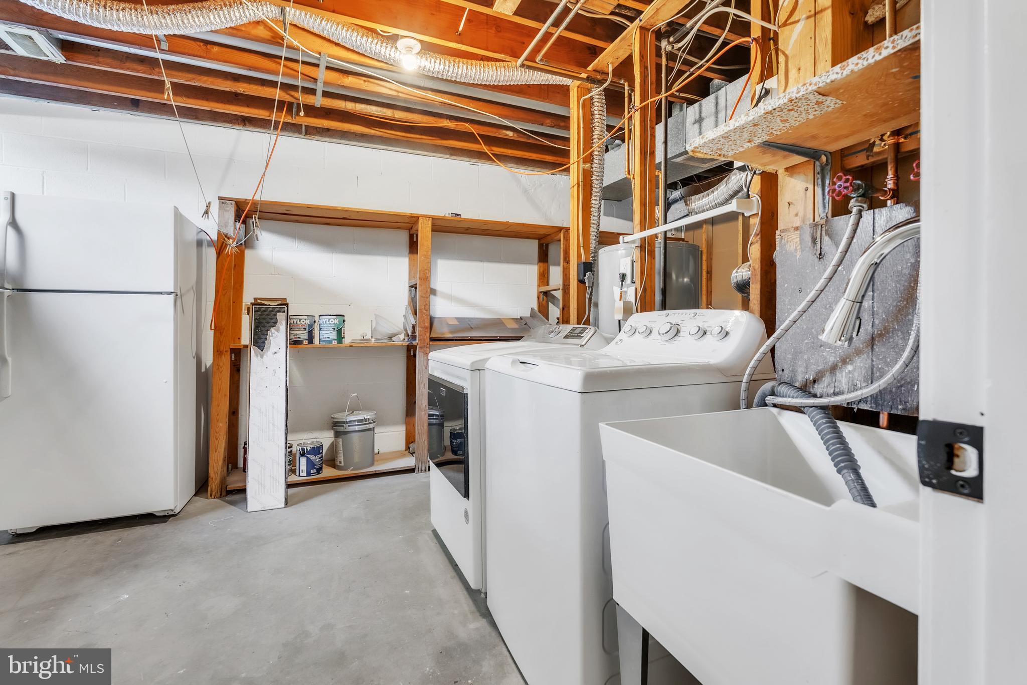 8074 Inverness Ridge Road Potomac, MD 20854 - Photo 33 of 41 a utility room with dryer and washer