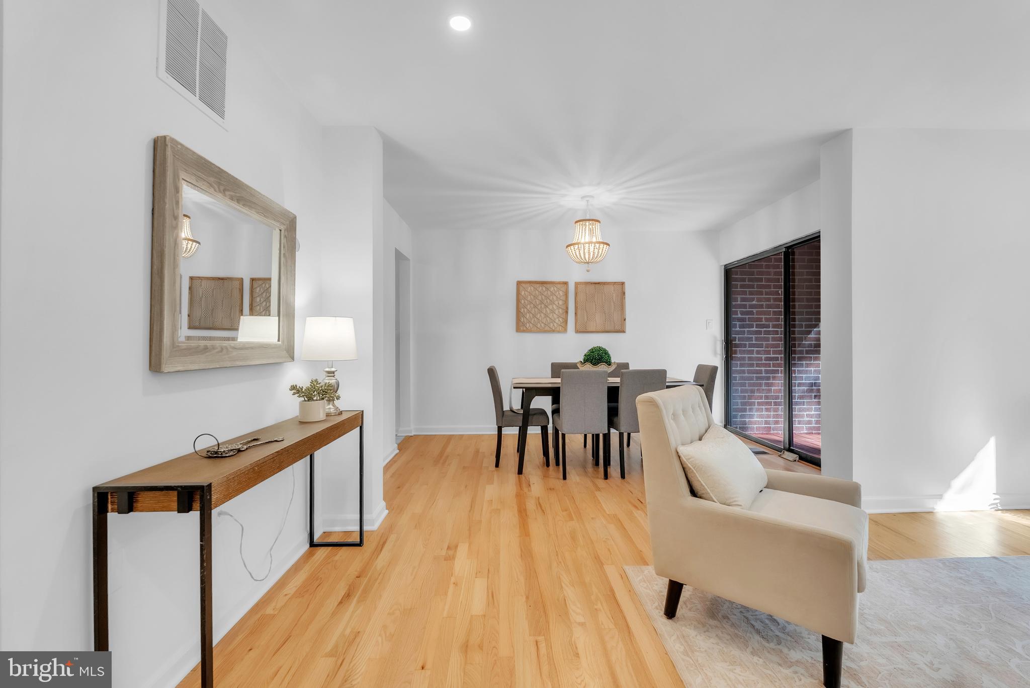 8074 Inverness Ridge Road Potomac, MD 20854 - Photo 7 of 41 a dining room with furniture and wooden floor