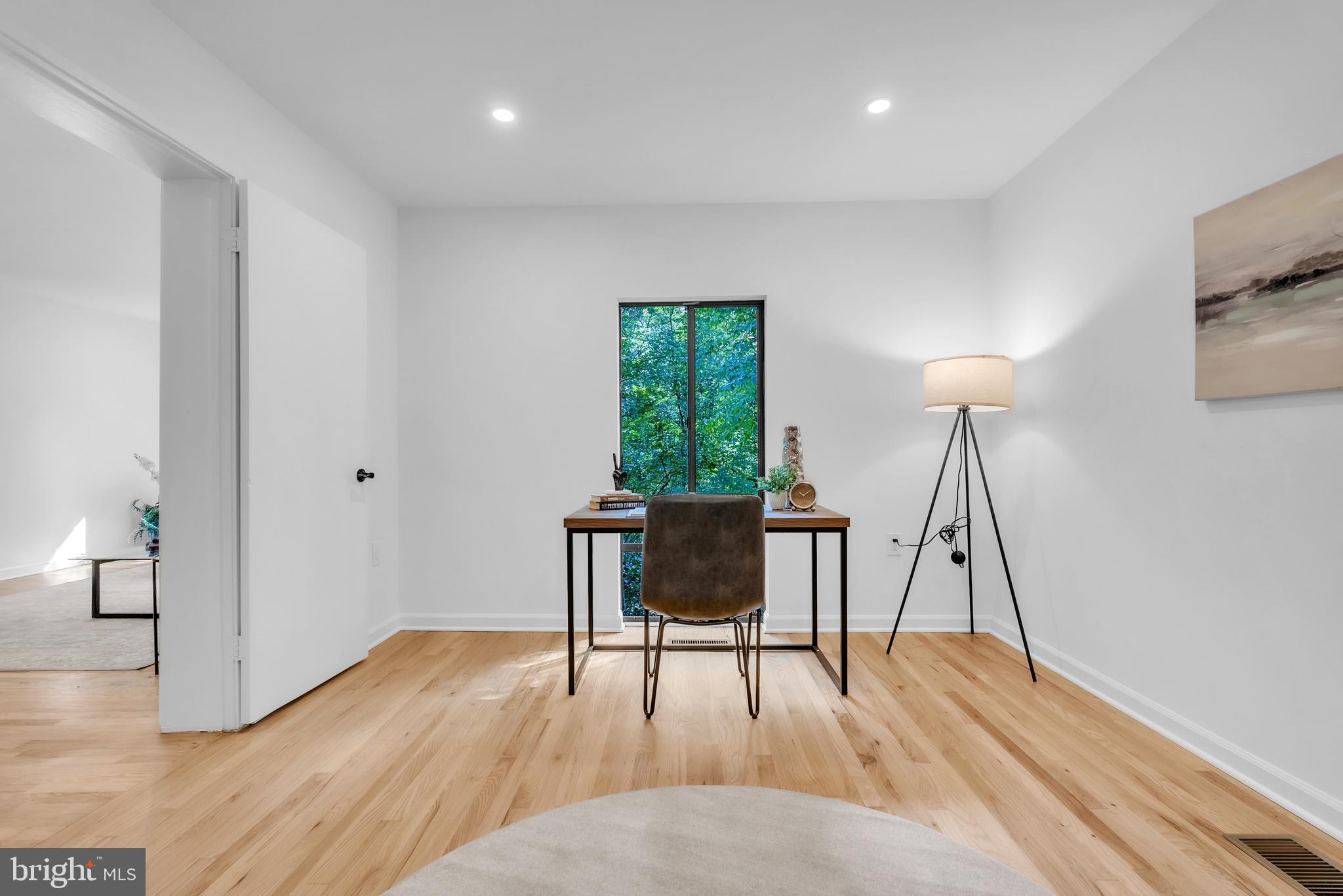 8074 Inverness Ridge Road Potomac, MD 20854 - Photo 10 of 41 a workspace with furniture window and wooden floor