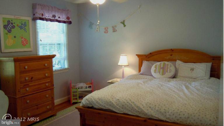 15613 Jones Lane Gaithersburg, MD 20878 - Photo 12 of 21 a bedroom with a bed and a flat tv screen on dresser