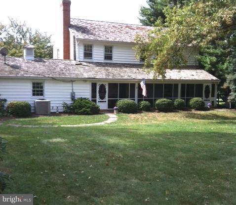 15613 Jones Lane Gaithersburg, MD 20878 - Photo 5 of 21 a front view of house with yard and green space