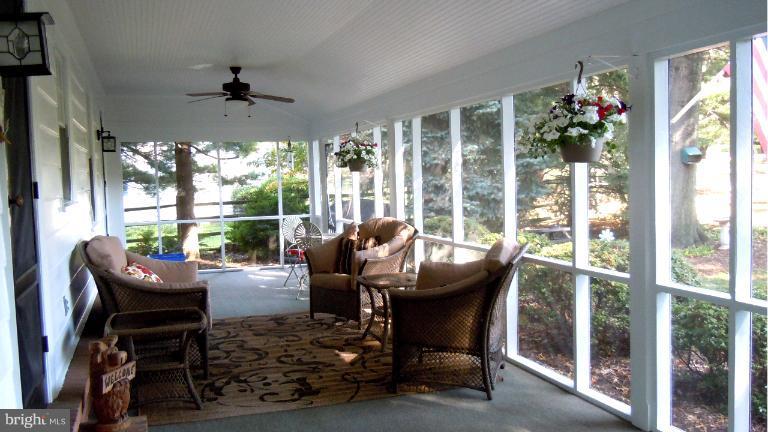 15613 Jones Lane Gaithersburg, MD 20878 - Photo 6 of 21 a living room with furniture and a large window