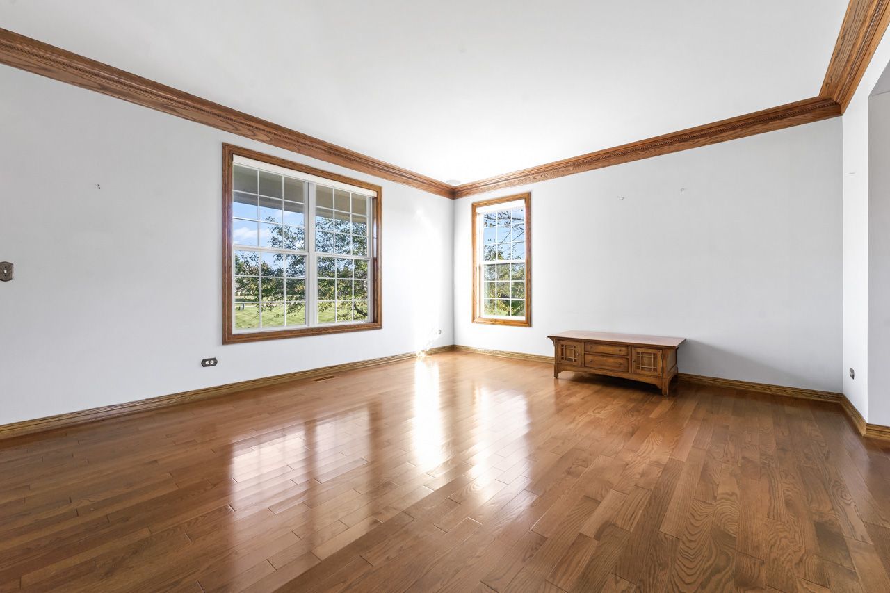 9307 Daniel Lane Spring Grove, IL 60081 - Photo 11 of 70 wooden floor in an empty room with a window