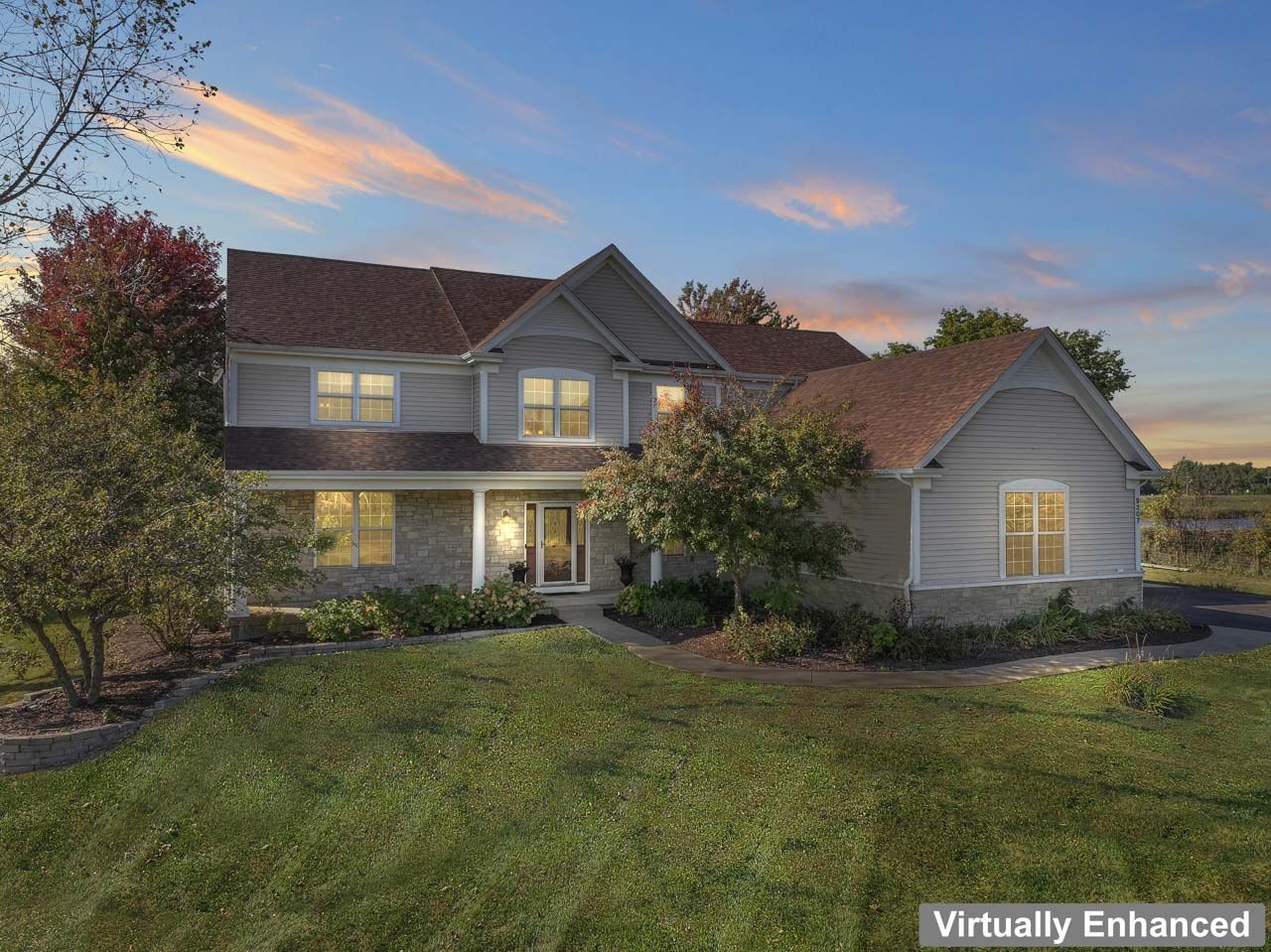 9307 Daniel Lane Spring Grove, IL 60081 - Photo 2 of 70 a front view of a house with a yard and trees