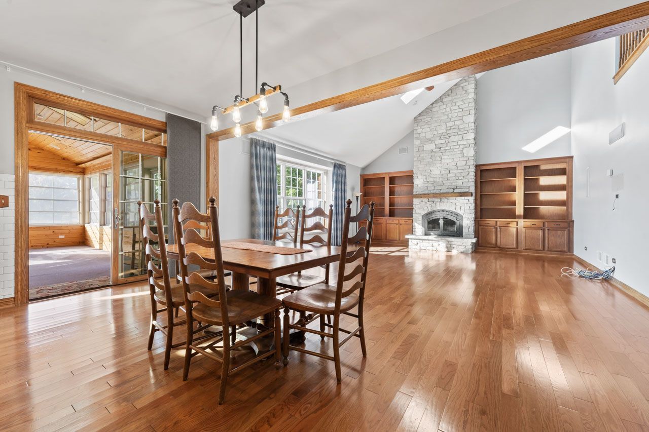 9307 Daniel Lane Spring Grove, IL 60081 - Photo 27 of 70 a view of a dining room with furniture window and wooden floor
