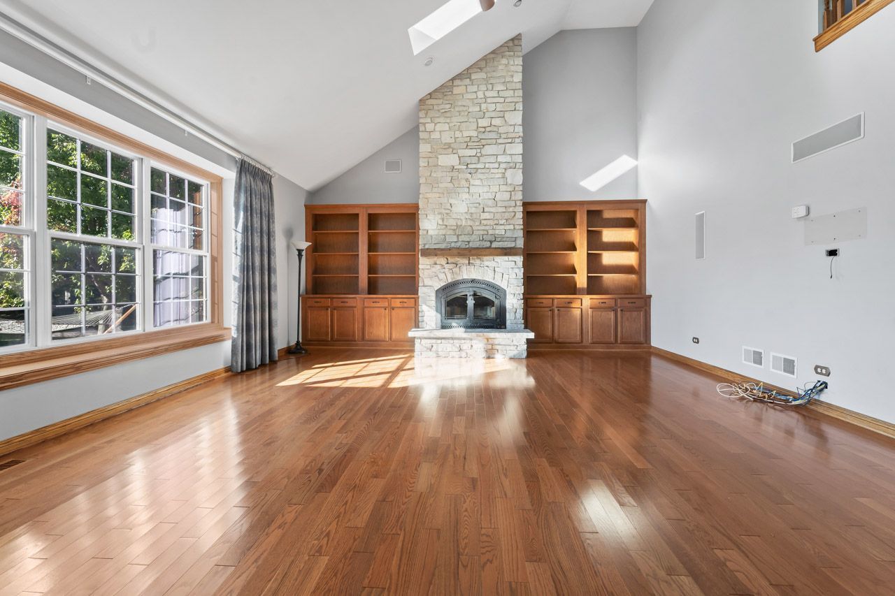 9307 Daniel Lane Spring Grove, IL 60081 - Photo 28 of 70 a view of empty room with wooden floor and fan