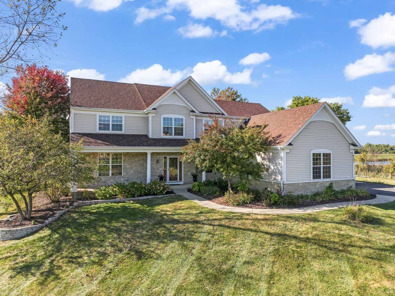 9307 Daniel Lane Spring Grove, IL 60081 - Photo 3 of 70 a front view of a house with a yard