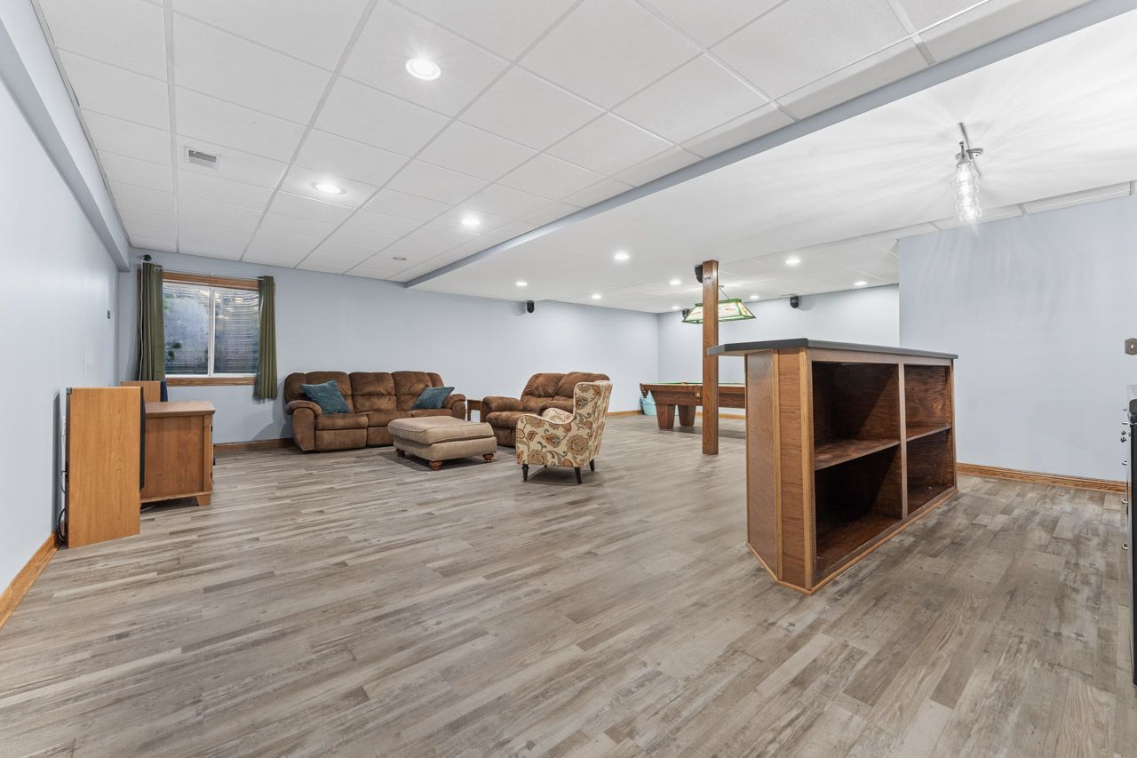 9307 Daniel Lane Spring Grove, IL 60081 - Photo 51 of 70 a living room with furniture and a flat screen tv