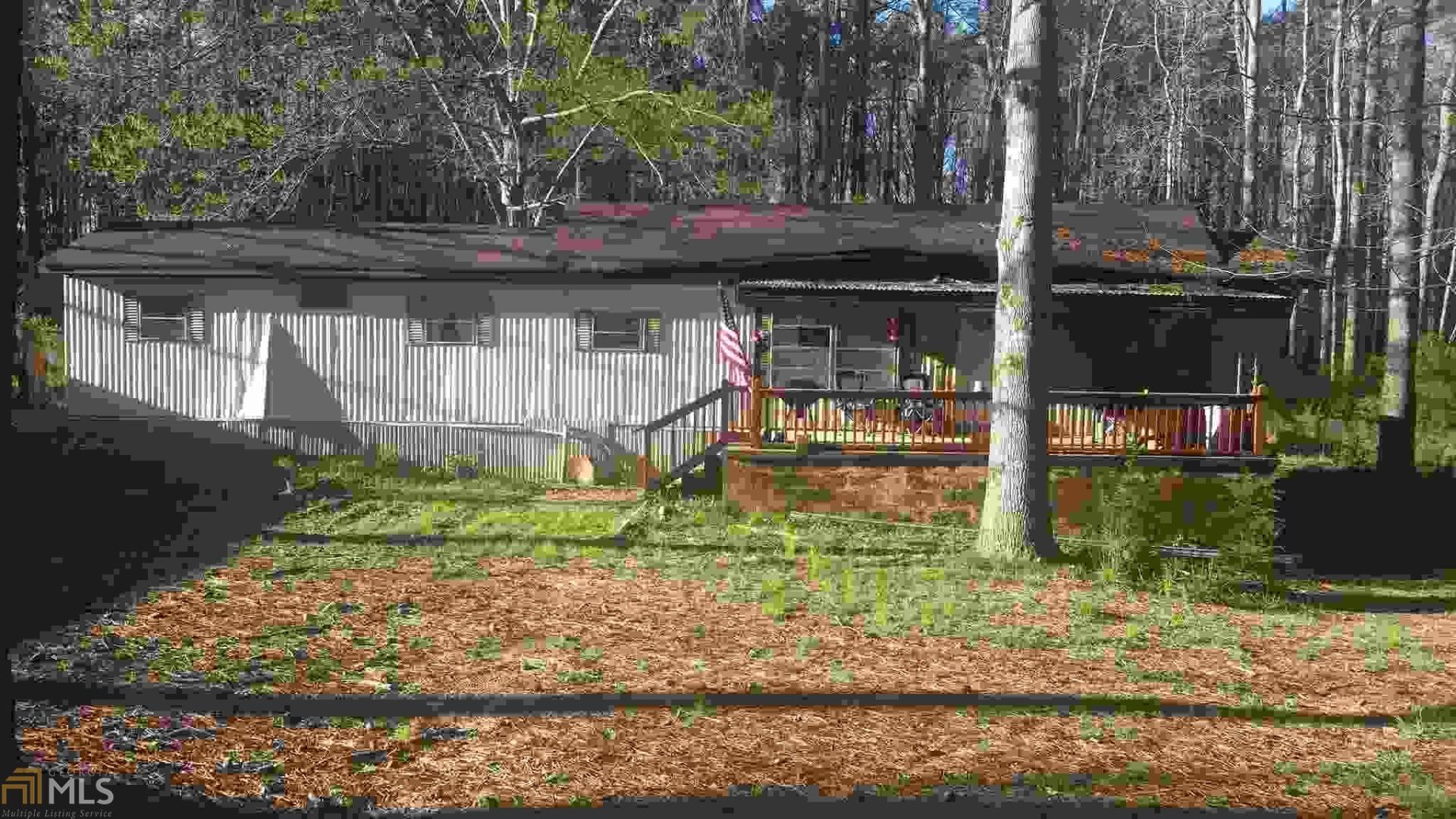 168 East Ranchette Road Temple, GA 30179 - Photo 1 of 1 a front view of a house with garden