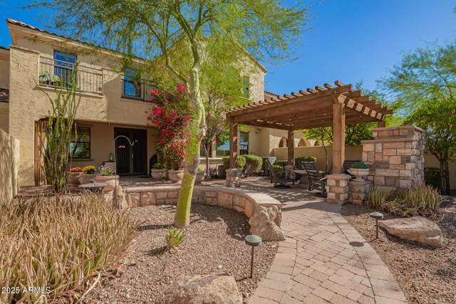 a view of city street with a building and trees in the background