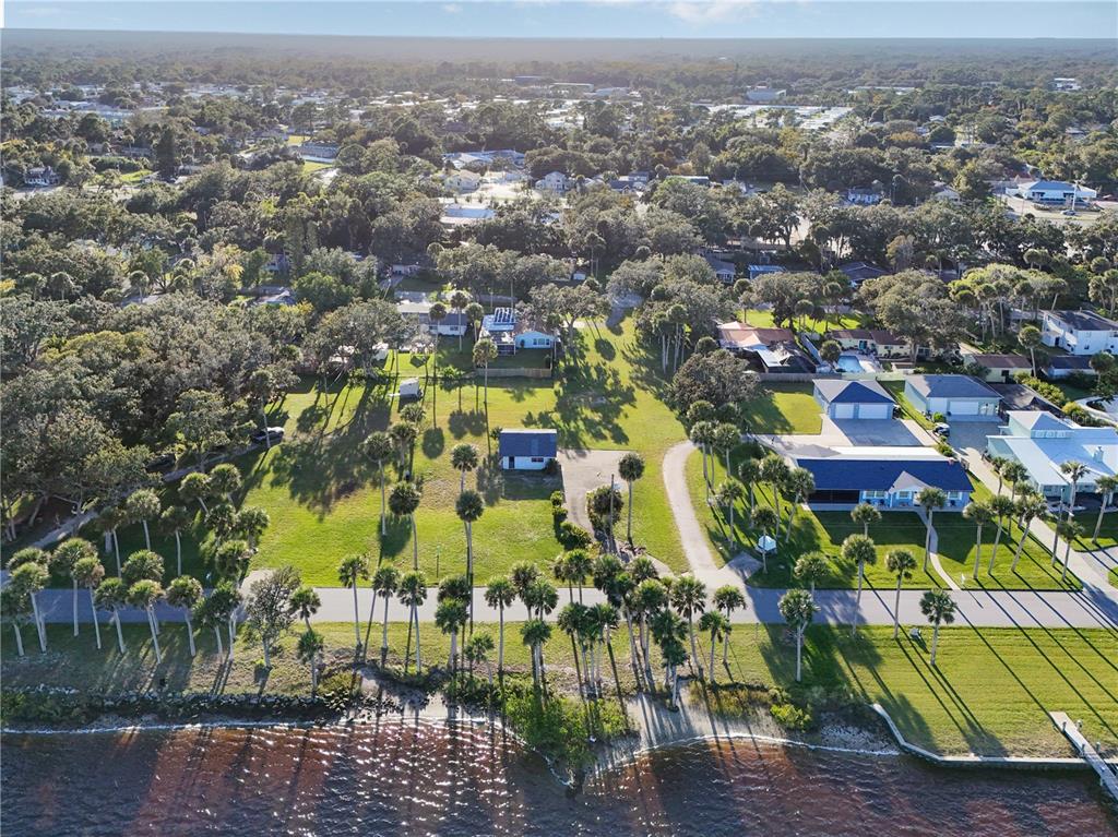5040 Riverside Drive Port Orange, FL 32127 - Photo 6 of 6 an aerial view of residential houses with outdoor space