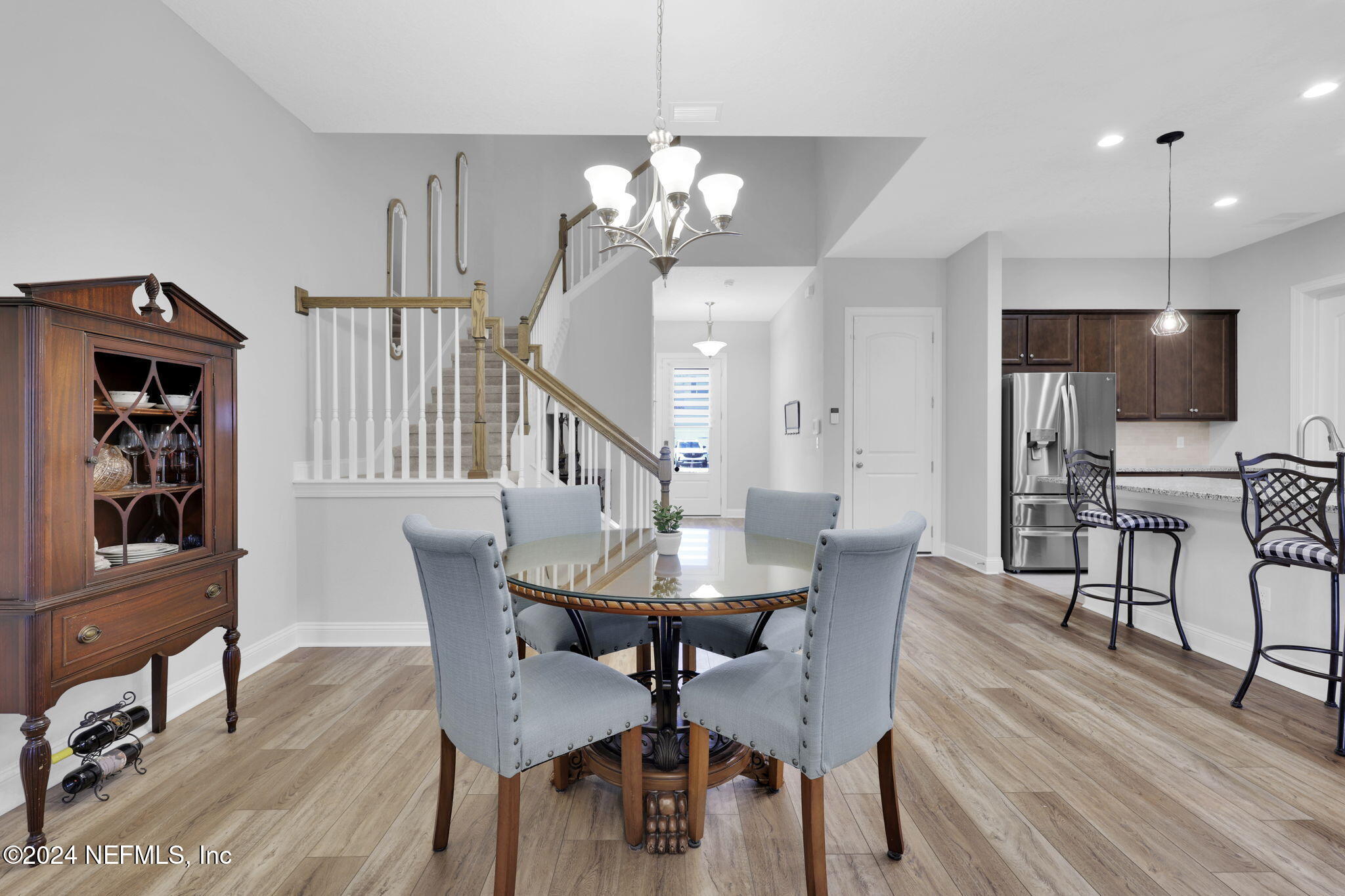 217 Liberty Bell Road Ponte Vedra, FL 32081 - Photo 15 of 50 a view of a dining room with furniture and wooden floor
